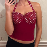 Red polka dot top worn by a person
